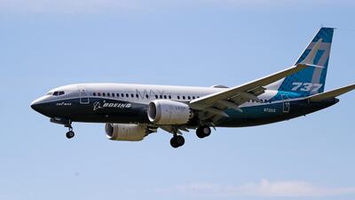 A Boeing 737 Max jet comes in to land at a Boeing air field after a test flight in June in Seattle. AP