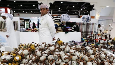 Falcon head caps on display at the Alhashimia Falconry stand at Adihex.