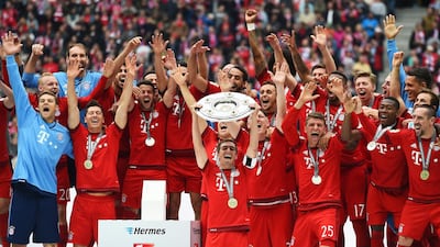 Bayern Munich captain Philipp Lahm lifts the Bundesliga trophy on May 23, 2015, nearly one month after Bayern had won the title. Getty Images