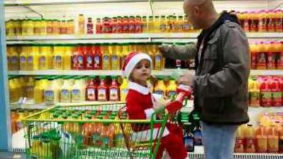 Two year old Ryan Hamood and his father Qais, 39, from the UK, shop at Lulu Hypermarket in Al Wahda Mall.