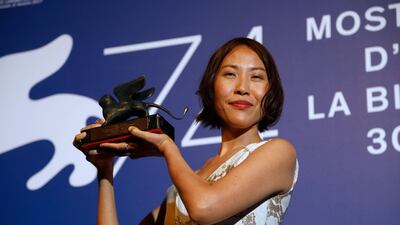 Gina Kim holds the Venice Virtual Reality Prize for best VR story during the awards photo call at the 74th Venice Film Festival. Domenico Stinellis / AP photo