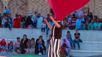 Otto Bas Sotto from Italy performs a trick with his giant red balloon. Victor Besa for The National