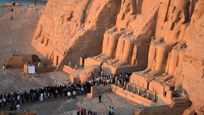 People visit the Great Temple of Ramses II, to observe the sun to send a beam of light into the ancient temple’s dark inner chamber for over ten minutes in Abu Simbel, 870 kilometers (540 miles) south of Cairo. Hundreds of people visited the temple to watch the sun illuminate colossal statues, a rare 3,200-year-old astronomical ceremony that happens twice a year. Ibrahim Zayed / AP Photo