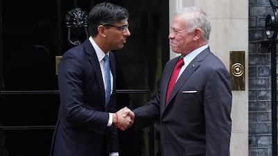 Mr Sunak and King Abdullah at the door to 10 Downing Street. PA