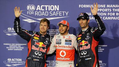 Vettel, Lewis Hamilton and Mark Webber at the press call following qualifying. Vettel would be demoted down the grid shortly afterwards. Christopher Pike/The National.