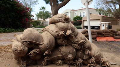 Flooding defence in the Green Community as the rain comes down in Dubai. Chris Whiteoak / The National