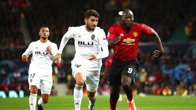 Manchester United' Romelu Lukaku battles for possession with Valencia's Cristiano Piccini. Getty Images