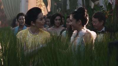 Kris Aquino as Princess Intan wearing Michael Cinco, and Constance Wu as Rachel. Warner Bros