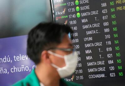 Wearing a face mask does not gaurantee that travellers will be safe from infection. REUTERS/David Mercado