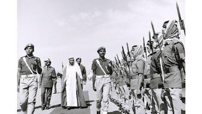 Sheikh Zayed reviews the troops at a military awards ceremony in 1976. Courtesy Al Ittihad