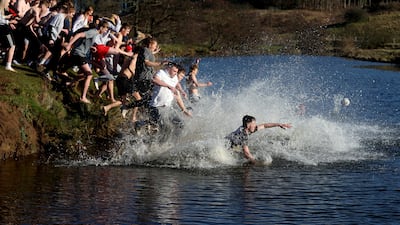 People from rival parishes of St Michael and St Paul compete in Scoring the Hales annual Shrove Tuesday Football match in Alnwick. Reuters