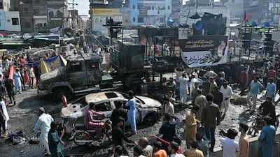 Charred vehicles lined the streets after clashes between Pakistani police and anti-Israel protesters from the Tehreek-e-Labbaik Pakistan party in the north-eastern city of Muridke. AFP