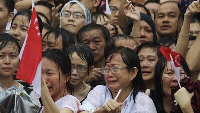 Singaporeans weep as the coffin carrying Lee Kuan Yew passes by on March 29, 2015 in Singapore. Ed Wray/Getty Images