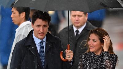 Canada's Prime Minister Justin Trudeau arrives with his wife Sophie Gregoire at Kansai airport in Izumisano city, Osaka prefecture ahead of the G20 Osaka Summit. AFP