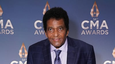 Charley Pride holds his Willie Nelson Lifetime Achievement Award backstage at the 54th annual Country Music Association Awards in Nashville, Tennessee. Reuters