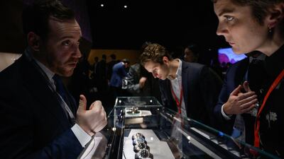 An exhibitor talks to a visitor at the booth of luxury Swiss watchmaker Audemars Piguet on opening day of the 29h International Fine Watchmaking Exhibition SIHH, on January 14, 2019 in Geneva. AFP