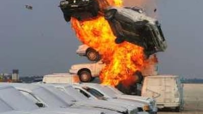 With flames all around, Mark Hager performs a spectacular car jump. He will be at the Al Ain Aerobatic Show this month.