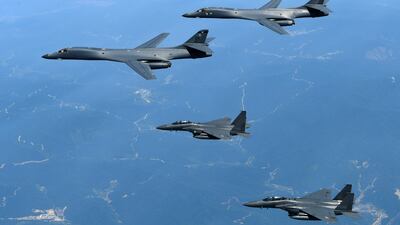 US B-1B bombers, top, and South Korean F-15K fighters over South Korea during exercises in June 2017. AP