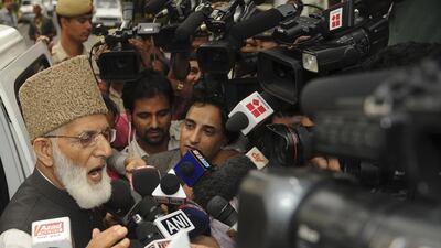 July 26 2011: Chairman of Kashmir's hardline faction of All Parties Hurriyat Conference, Syed Ali Shah Geelani, centre, talks with the media outside the Pakistan High Commision following a meeting with Pakistani Foreign Minister Hina Rabbani Khar. They wi???