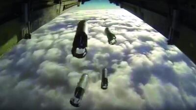 A Russian bomber drops bombs on a target. Russia has unleashed another barrage of airstrikes against targets in Syria, including the first combat launch of a new cruise missile from a Russian submarine in the Mediterranean Sea. Russian Defense Ministry Press Service via AP