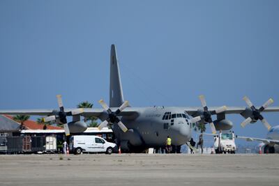 A Greek military transport aircraft carrying Greek and Cypriot citizens evacuated from Lebanon lands at Larnaca Airport. AP