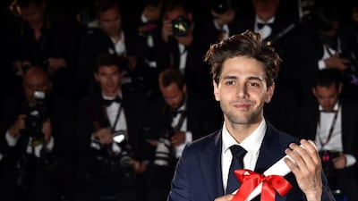 Canadian director Xavier Dolan poses with his prize after being awarded with the Grand Prix for the film It’s Only The End Of The World (Juste La Fin Du Monde)AFP