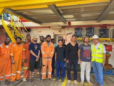 Welfare officer Willy Nebria, far right, from the Mission to Seafarers, with crew members stranded in the UAE. Photo: Mission to Seafarers