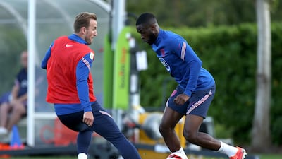 Fikayo Tomori is challenged by teammate Harry Kane during a training session at Tottenham Hotspur Training Centre.s