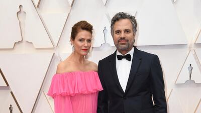 Sunrise Coigney and Mark Ruffalo, wearing Valentino, arrive at the Oscars on Sunday, February 9, 2020, at the Dolby Theatre in Los Angeles. AP