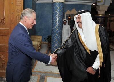 Prince Charles shakes hands with then-Qatari prime minister Sheikh Hamad bin Jassim Al Thani at his residence outside Doha, Qatar, in March 2013. PA