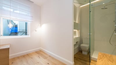 The bathroom is adjoined to the main, and only, room. Courtesy Harrods Estates