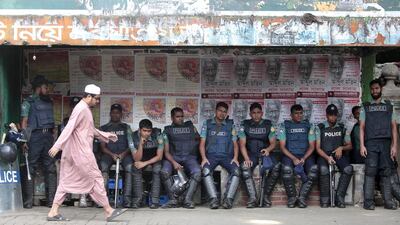 Bangladeshi police officers outside a special war crimes tribunal ahead of a verdict of Jamaat-e-Islami chief Motiur Rahman Nizami, in Dhaka on October 29, 2014. The leader of the country’s largest Islamic party is sentenced to death in the latest ruling by a controversial a crimes tribunal. AM Ahad/AP Photo