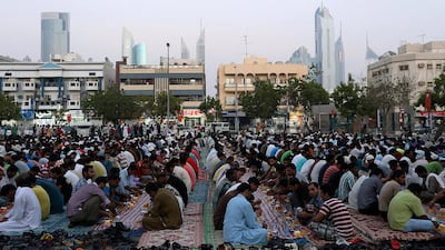 People gather to break their fast on the last of the Ramadan near the Satwa area of Dubai. July 16, 2015 Satish Kumar / The National