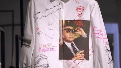 One of the unique shirts created for “Tribute to the Karl Lagerfeld: The White Shirt Project”, showing images of both Lagerfeld and his cat, Choupette. Getty