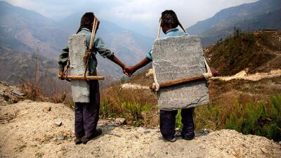 In the Himalayas, Lisa Kristine captured these brothers carrying slate down the mountainside. Below, trucks are waiting to take the slate and eventually sell it. “We all knowingly or unknowingly participate in slavery every day," said Kristine at a conference in London, noting that the slate these boys are carrying may be used in our homes.