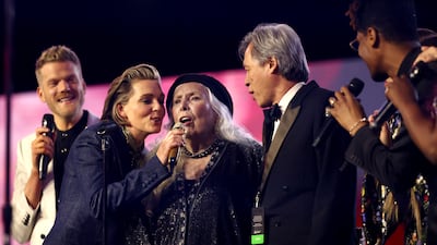 From left to right: Scott Hoying of Pentatonix, Brandi Carlile, Joni Mitchell and Jon Batiste perform onstage during MusiCares Person of the Year honouring Mitchell at MGM Grand Marquee Ballroom, Las Vegas, in April.