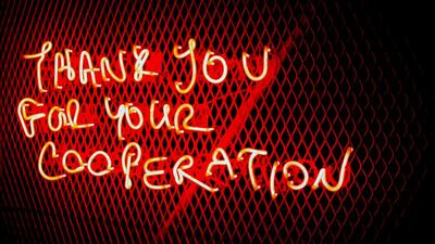 A metal gate with neon writing sits at the entrance of Gallery Isabelle Van Den Eynde. Courtesy Gallery Isabelle Van Den Eynde