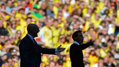 Managers of both sides, Crystal palace's Ian Holloaway, left, and Gianfranco Zola, of Watford, went about their business on the touchline in typical fashion. Toby Melville / reuters