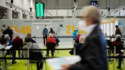 People wait at a vaccination centre in Berlin. AP Photo