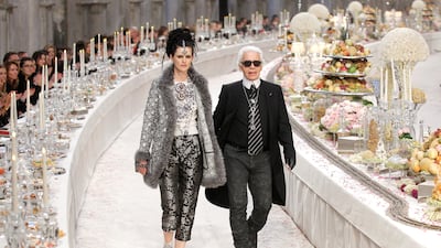 Lagerfeld with model Stella Tennant during Chanel's Metiers d'Art show in 2011. Reuters