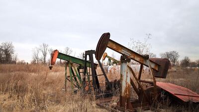 Idled oil well pumps sit at a yard in Woodlawn, Illinois. Scott Olson / Getty Images / AFP