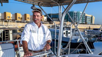 Captain Greg Heinricks, aboard his boat Reel Teezer, runs a fishing charter business in Al Bateen. Victor Besa / The National