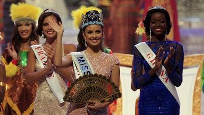 Newly crowned Miss World Megan Young of the Philippines, centre, waves, after winning the Miss World contest. Firdia Lisnawati / AP Photo