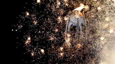 Fireworks go off after the Olympic cauldron is lit. Phil Noble / Reuters