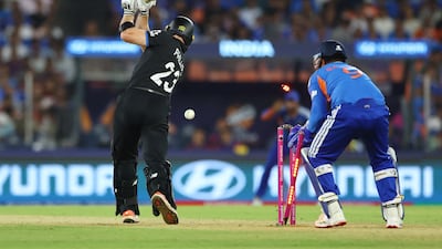 New Zealand batter Glenn Phillips is bowled out by India's Axar Patel. Reuters