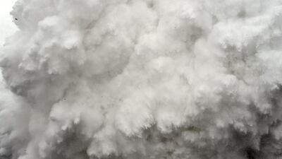This file photo taken by Agence France-Presse (AFP) photographer Roberto Schmidt on April 25, 2015 shows a cloud of snow and debris triggered by an earthquake flying towards Everest Base Camp, moments ahead of flattening part of the camp in the Himalayas. AFP’s veteran lensman Roberto Schmidt on February 18, 2016 won second prize at the prestigious World Press Photo Award in the Spot News stories category, for his dramatic shots of the deadly avalanche on Mount Everest triggered by last April’s Nepal earthquake. Roberto Schmidt / AFP Photo