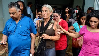 Fiona MacKeown leaves the court in Panaji, Goa, India, with her lawyer Vikram Verma, left, on September 23, 2016, after two suspects in the 2008 death of her teenage daughter were acquitted. Associated Press