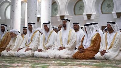 Sheikh Mohammed bin Zayed, Crown Prince of Abu Dhabi Deputy Supreme Commander of the UAE Armed Forces, third right, with, from right, Sheikh Suroor bin Mohammed; Sheikh Saif bin Mohammed; Sheikh Hazza bin Zayed, Vice Chairman of the Abu Dhabi Executive Council; Sheikh Saeed bin Zayed, Abu Dhabi Ruler's Representative; Shaykh Abdallah bin Bayyah; and Sheikh Nahyan bin Zayed, Chairman of the Board of Trustees of Zayed bin Sultan Al Nahyan Charitable and Humanitarian Foundation, attend Eid Al Fitr prayers at the Sheikh Zayed Grand Mosque in Abu Dhabi. Hamad Al Kaabi / Crown Prince Court - Abu Dhabi