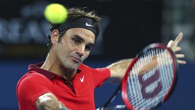 Roger Federer plays a backhand shot during his win over Milos Raonic in the ATP Brisbane International on Sunday. Tertius Pickard / AP