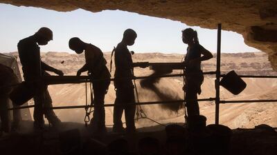 Volunteers take part in an excavation in search for archaeological artefacts at a cave in the Tzeelim Canyon above the Dead Sea, Israel. Menahem Kahana / AFP Photo
